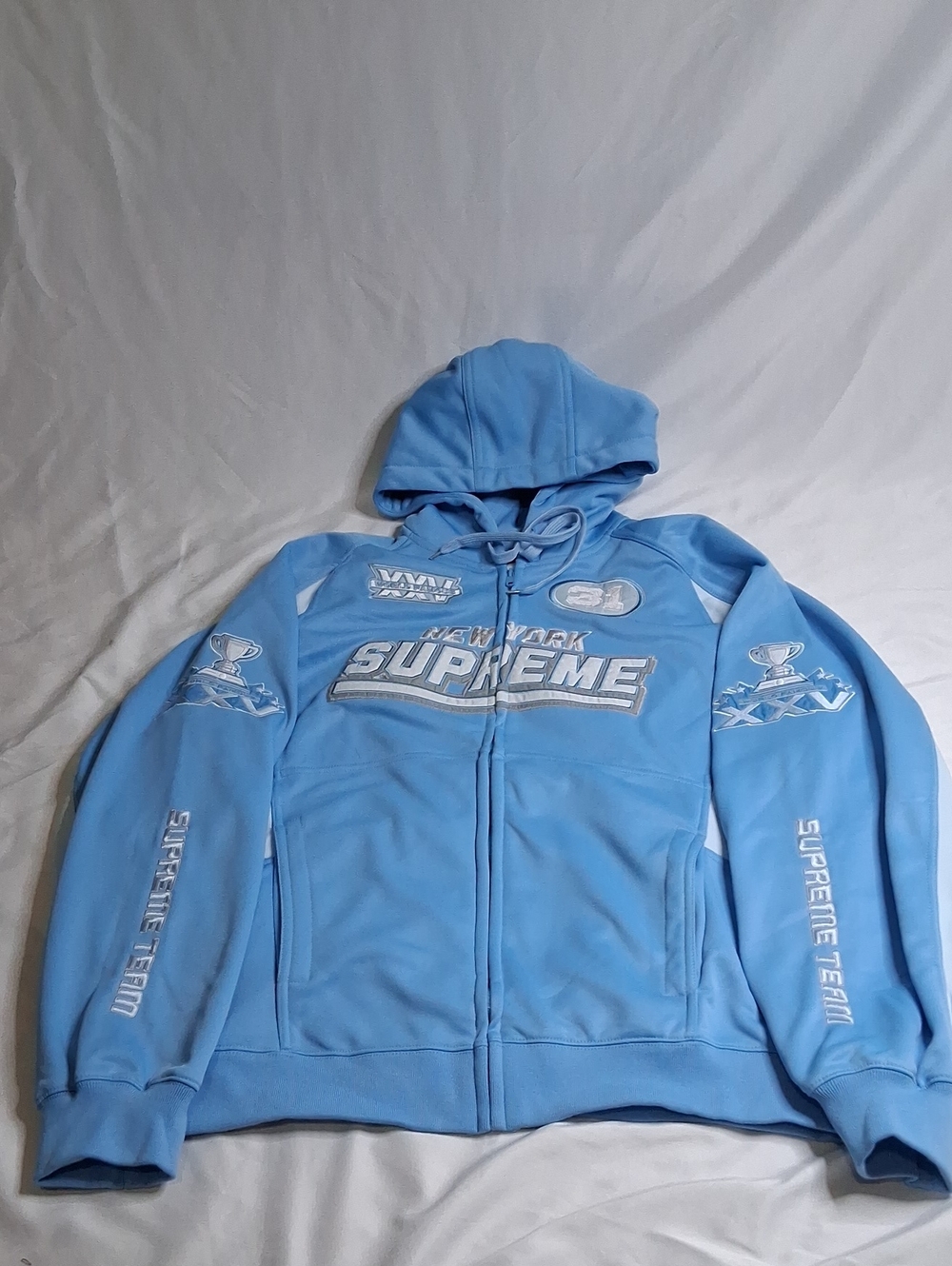 Supreme Light Blue Zip-Up Hoodie with Racing Patches